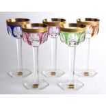 A set of five Mosers glass wine glasses, 20th century, the bowls with gilt incised band above fluted
