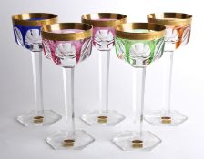 A set of five Mosers glass wine glasses, 20th century, the bowls with gilt incised band above fluted