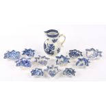 An 18th Century Worcester parrot and fruit pattern jug crescent mark to base together with an