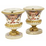 A pair of Derby porcelain Imari pot pourri urns, early 20th century of urn form with a central