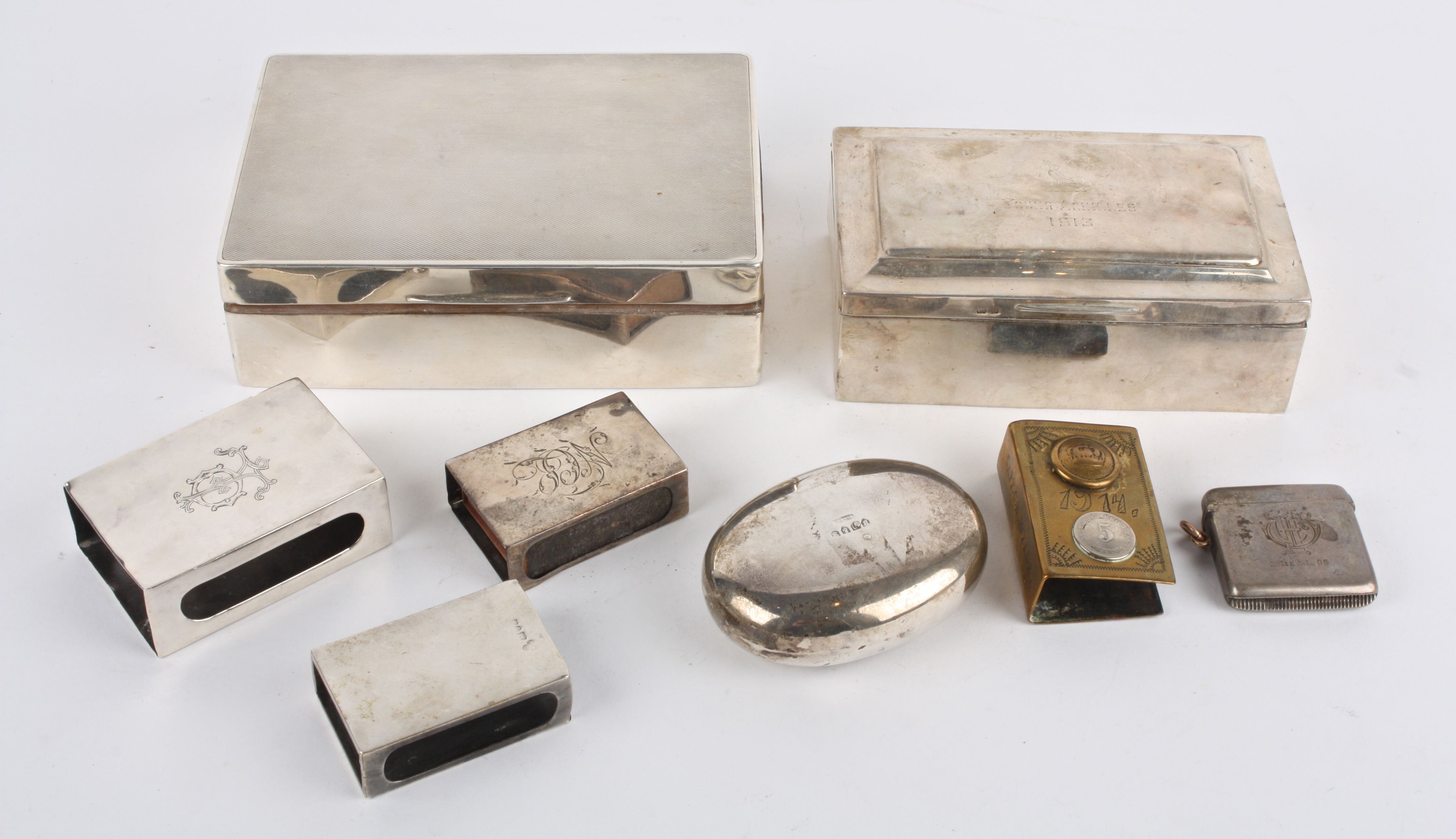 A good collection of silver boxes including a rectangular silver cigarette box hallmarked Birmingham