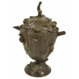 A bronze pedestal cup and cover, 20th century the baluster shaped body of the cup depicting a tree