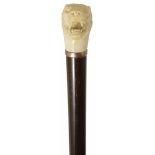 A late 19th century ivory handled walking stick in the form of a tiger the rosewood shaft