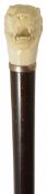 A late 19th century ivory handled walking stick in the form of a tiger the rosewood shaft