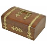 A late 19th century walnut veneered jewellery casket of slight domed top, with applied brass strap