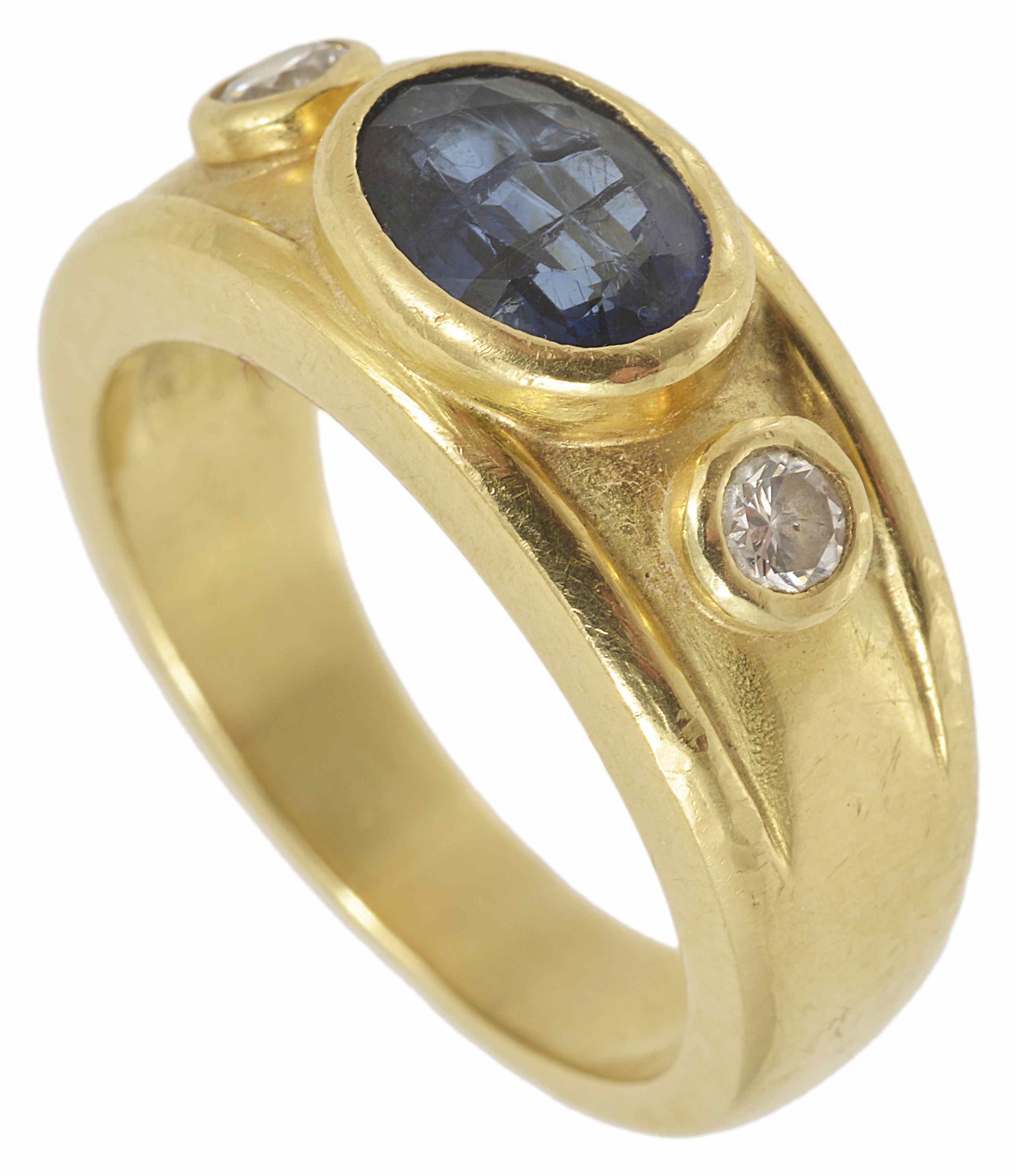 A large heavy 18ct gold mounted gentleman's sapphire and diamond set ring the central oval blue