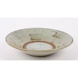 An 18th Century Chinese Swatow pale Celadon pottery dish the raised edge painted with planted