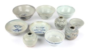 A collection of Chinese blue and white Swatow ceramics, late Ming to include two raddish painted