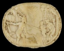 A 17th Century German carved ivory pill box possibly Black Forest, the lid depicting the legend of