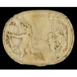 A 17th Century German carved ivory pill box possibly Black Forest, the lid depicting the legend of