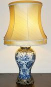 A large Chinese baluster shaped blue and white 19th century vase converted to a lamp with ornate