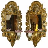 A gilt wooden sectional mirror wall light, 20th century the domed top with basket of fruit carving