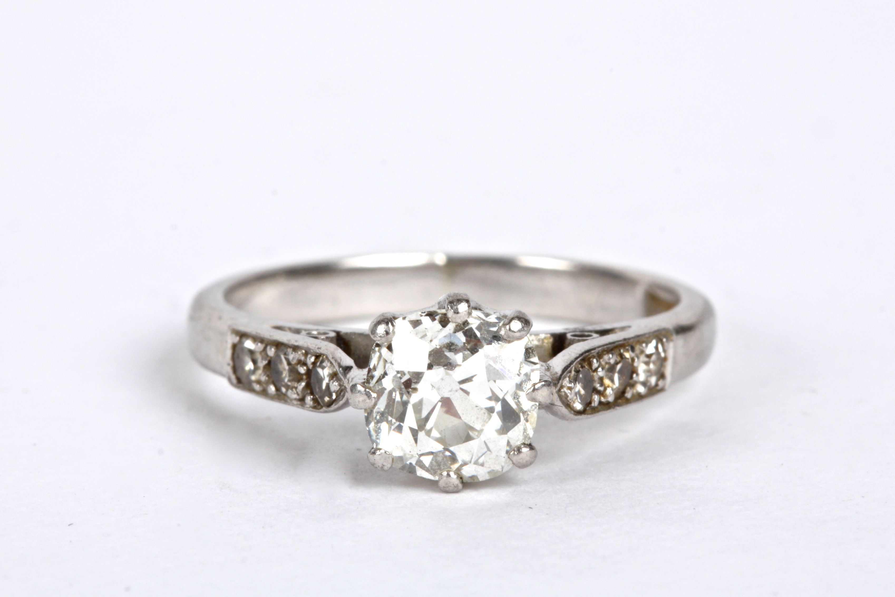 An Edwardian single stone diamond set ring the old cut diamond approx. 0.65ct and set within diamond