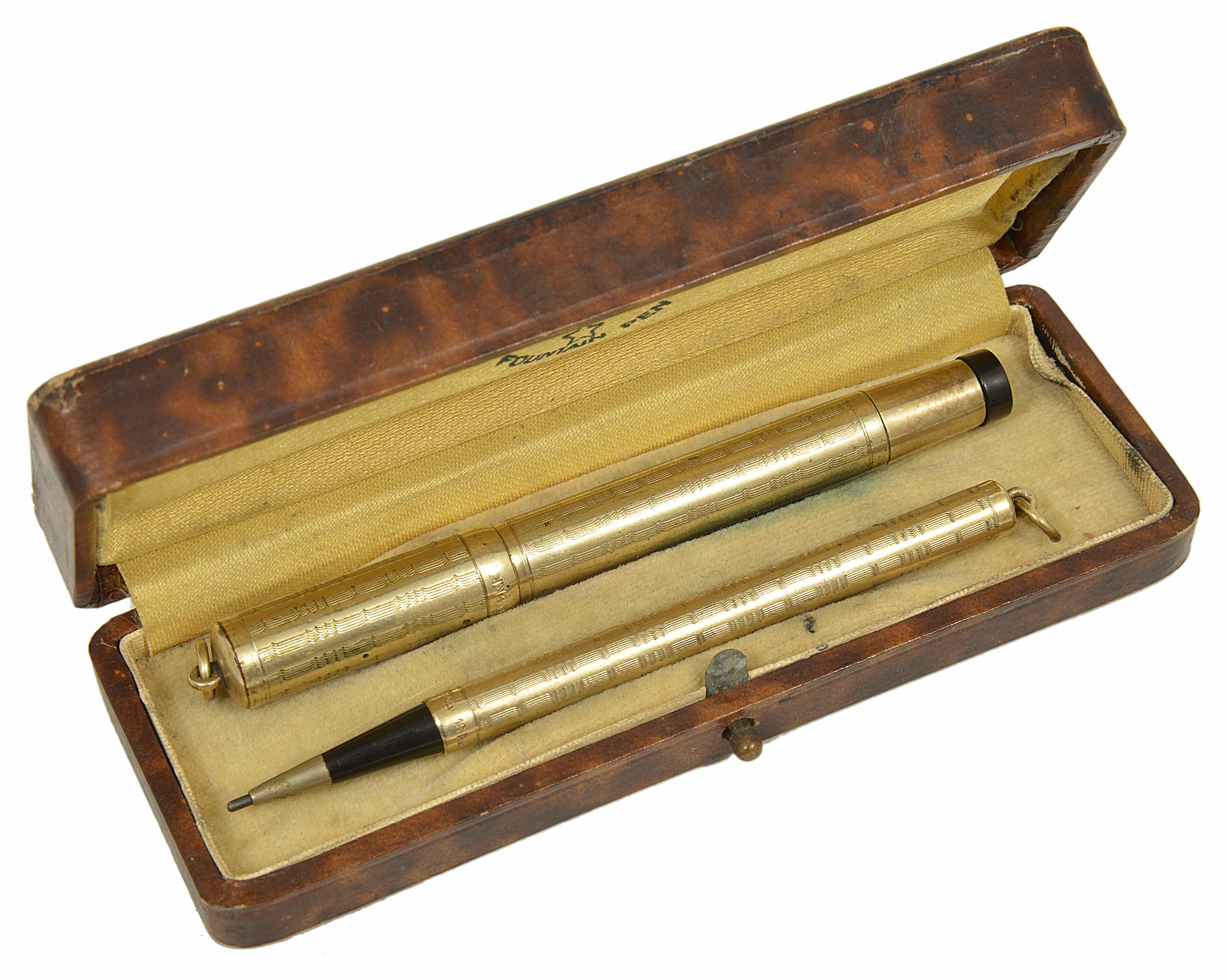 An early 20th century Star 18kr gold cased fountain pen and retracting pencil, each with engine