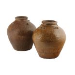 Two large Chinese late Ming Swatow stoneware, yellow glazed wine jars The ovoid shaped jars with