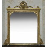A Victorian gilt overmantel mirror, the seated putti with garlands of leaves surmounting a