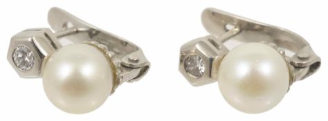 A pair of cultured pearl and diamond set earrings with single stone diamond in hexagonal white metal