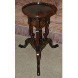 A mahogany side table, 19th century and later the circular dished top above associated base of two