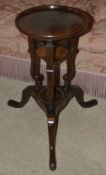 A mahogany side table, 19th century and later the circular dished top above associated base of two