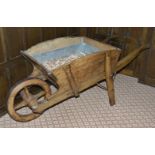 A French fruit wood wheelbarrow, late 19th century of typical form with rectangular section