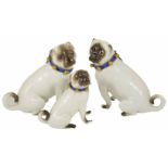 A pair of Meissen porcelain Pug Dogs, 19th century each in a seated position, with white body, faces