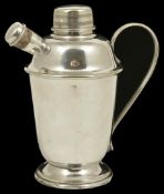 A vintage silver plated table cocktail shaker the spout with grill, screw lid and carrying handle to