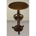 A mahogany circular top side table, 19th century with baluster turned column and turned central