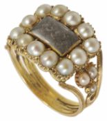 A Georgian gold pearl set memorial ring with pierced tendril twist detail to yellow metal mount (