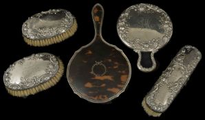 A Sterling silver dressing table suite, 20th century comprising of two oval brushes, hand mirror and
