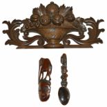 A tribal wooden spoon wall hanging, 20th century together with a Modern tribal wooden elephant and