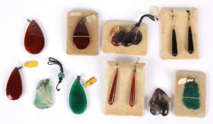 A collection of Chinese 1920's carved and other hard stone pendants and earrings comprising two