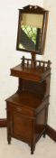 A gentleman's oak shaving stand and cupboard, 20th century the rectangular oak frame with mirror