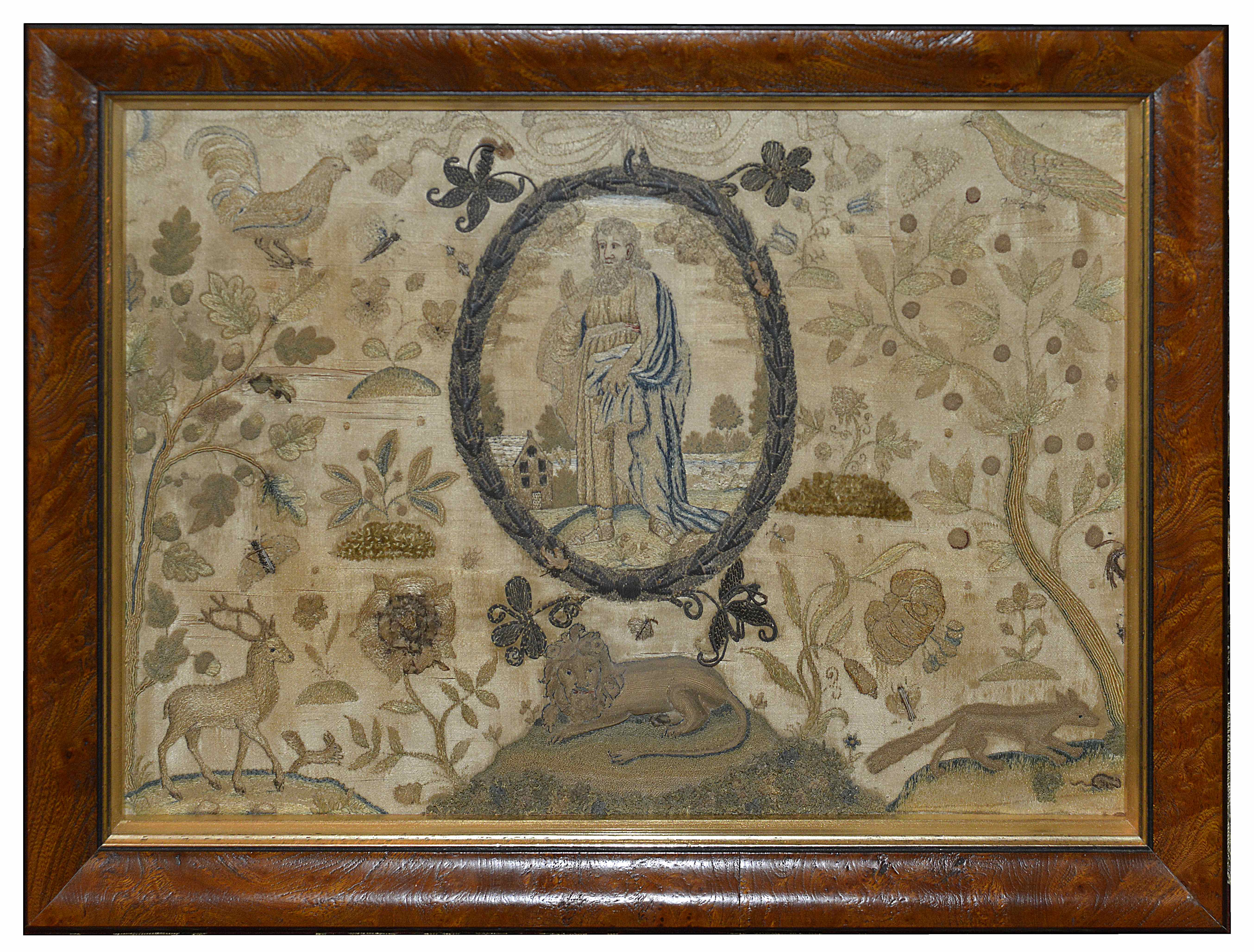 An early 18th Century silk and metallic thread needlework and stumpwork picture with central oval