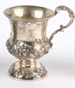 A Victorian silver tankard, London 1839, with applied foliate bands, raised upon a circular foot