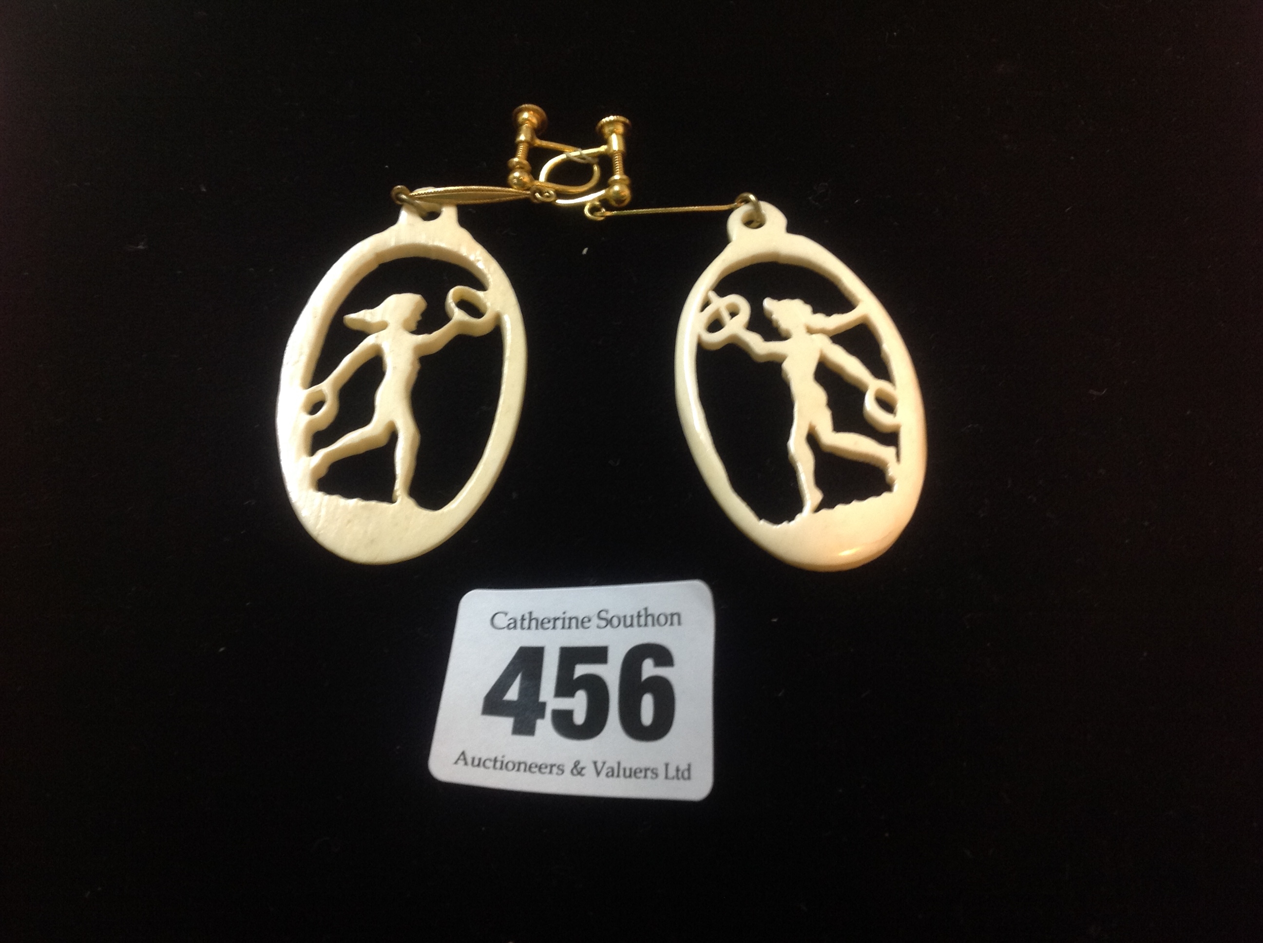 A collection of 1920's pierced and carved ivory silhouette pendant drops paired and with ear drop - Image 2 of 2