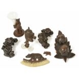 A collection of Black Forest wares, 20th century to include a standing bear holding a trumpet