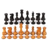 A harlequin set of Jaques Staunton style chess pieces, early 20th century comprising of boxwood and