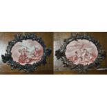 A pair of oak carved and porcelain plaques, late 19th century the first oval porcelain plaque