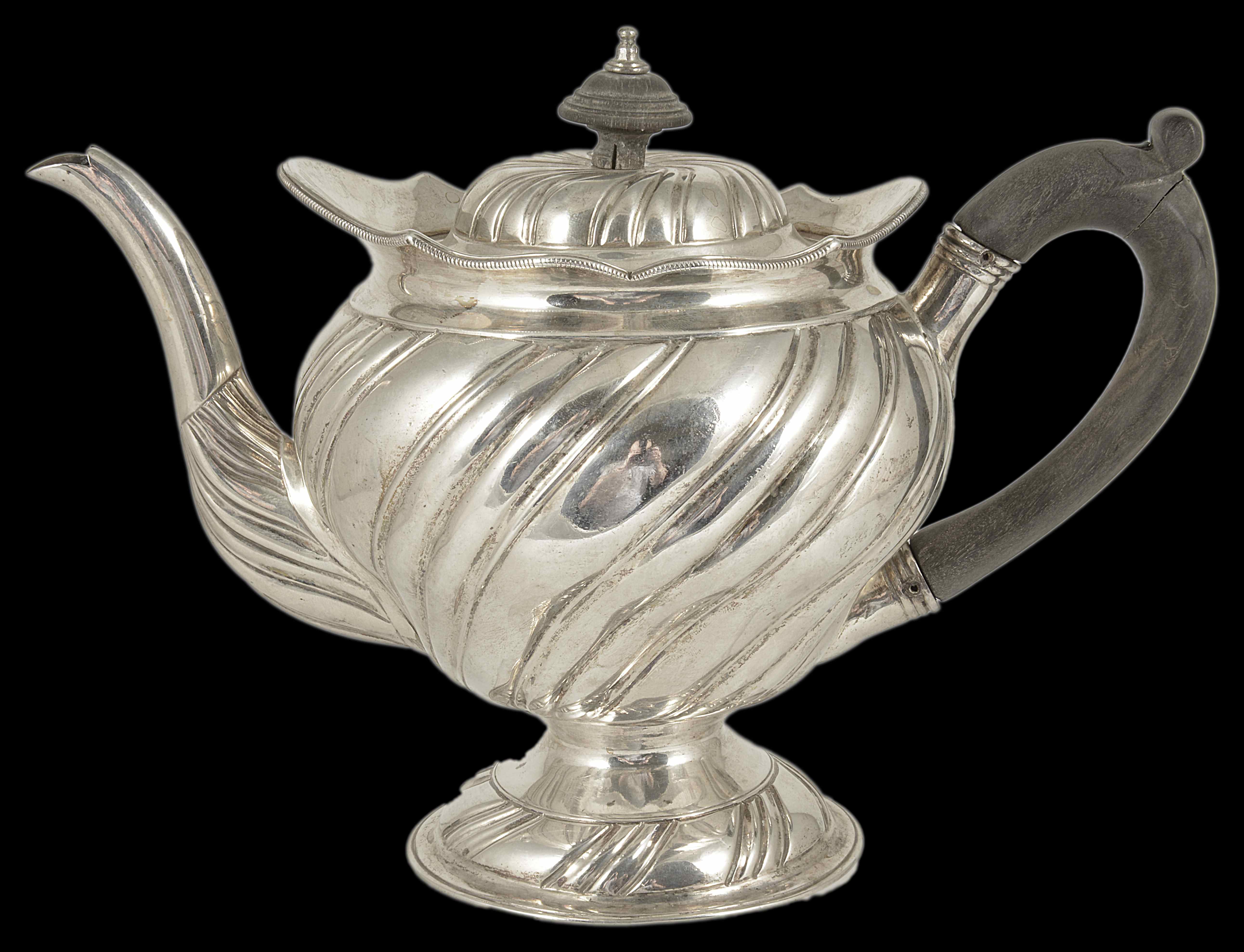 A George III silver teapot, London 1805 of baluster tapering fluted form upon a circular foot ring