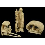 A Japanese ivory figure of a man and boy the man holding a hatchet, together with a Chinese ivory