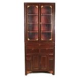 An Oriental hardwood cabinet, 20th century of rectangular form with two glazed doors with pierced