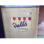 A vintage Walls commercial freezer circa 1960 with rubber twin lids to the top, and Walls transfer