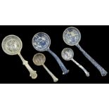 A collection of transfer printed ceramic ladles, 19th century and later four with blue and white