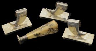 Three late 19th century tigers claw and white metal menu holders each of the menu holders with