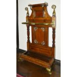 A Victorian brass bound oak umbrella stand the upper section with brass gallery rail above central