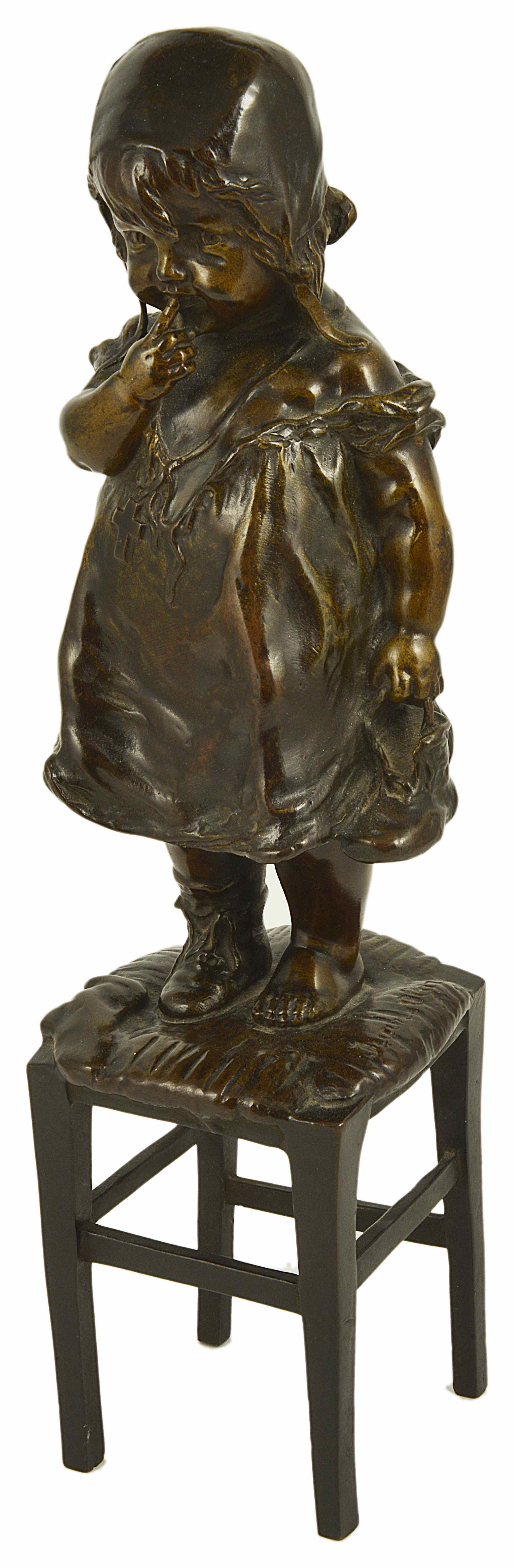 Juan Clara, Spanish (1875 - 1958) a bronze figure of a young girl standing upon a rush seated