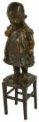 Juan Clara, Spanish (1875 - 1958) a bronze figure of a young girl standing upon a rush seated