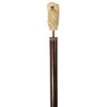 A late 19th century rosewood and ivory walking stick the rosewood shaft with carved ivory pommel
