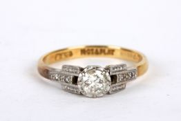 An Art Deco square mounted single stone diamond set ring 18ct gold and platinum mount, diamond