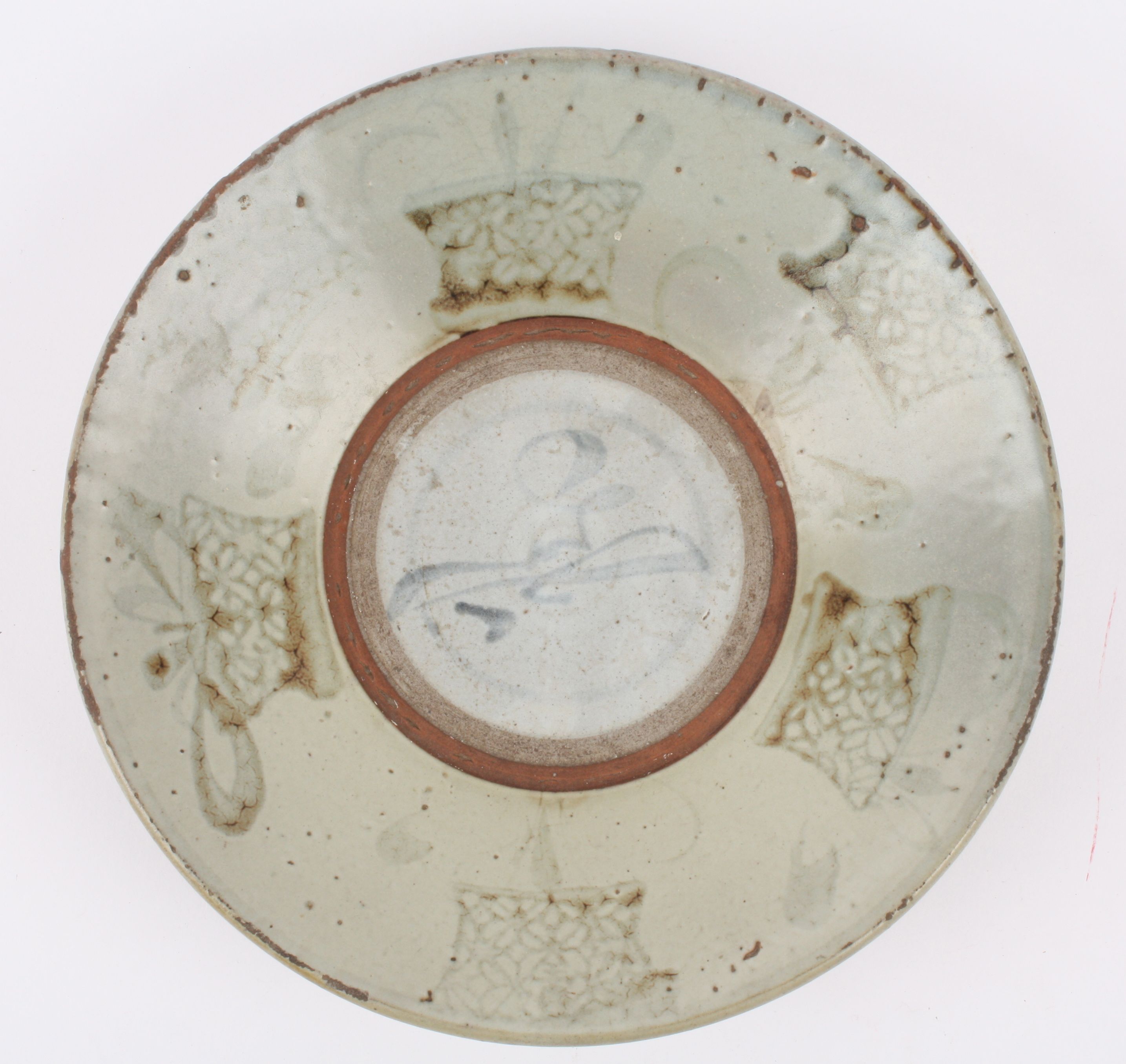 An 18th Century Chinese Swatow pale Celadon pottery dish the raised edge painted with planted - Image 2 of 3